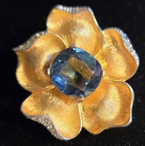 Gold Tone Flower Brooch with Blue Gemstone Center